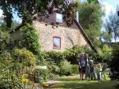 The Uden family pictured on the lawn at The Wheel House, Nutbourne's original mill which they lovingly restored. The picture was taken in 2003.