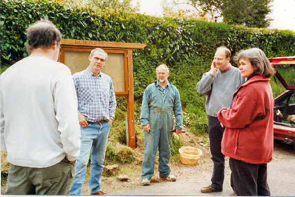 Volunteers erecting a new community noticeboard in Nutbourne, West Sussex, in a location opposite the Rising Sun.  Pictured left to right, Regan Howard (Landlord of The Rising Sun), Bob Allison (The Mill House), Frank Riddle (The Old Manor) and James and Veronic Thomson-Glover (Manor Farmhouse)