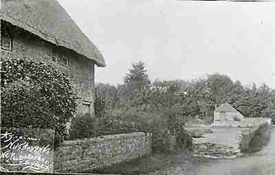 A postcard showing the original cottage by the mill pond in about 1910